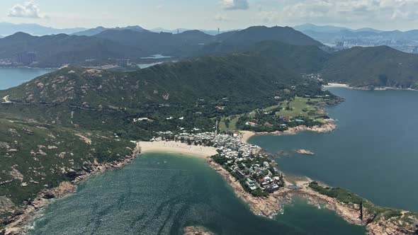 4K Aerial shot of the Village and beach in Shek O, Hong Kong.