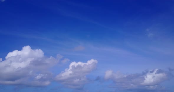 Beautiful aerial clean view of a white paradise beach and aqua blue water background in colorful 4K