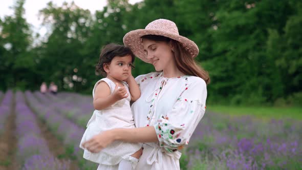 Mother Enjoying Time with Baby in Lavender Field