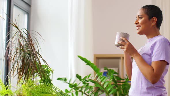 African American Woman Drinking Coffee at Home