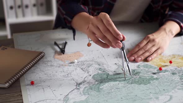 A Traveler Girl Measures Distances Between Points On A Map, Measuring The Distance On A Map