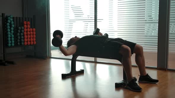 Senior Caucasian Man Lift Dumbbells to Pump Up His Biceps