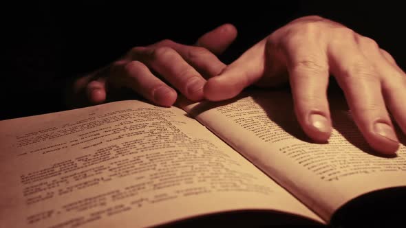 Reading an Old Book Under Atmospheric Yellow Lamp Lighting