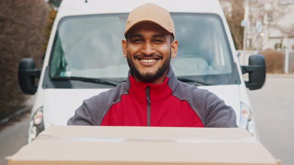 Portrait of Indian Man Delivering Parcel