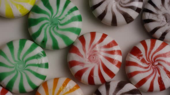 Rotating shot of a colorful mix of various hard candies - CANDY MIXED