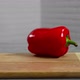 Bell pepper falls on a bamboo cutting board - VideoHive Item for Sale