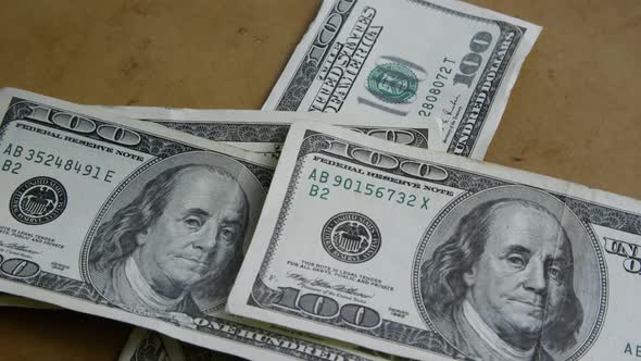 Rotating stock footage shot of $100 bills 