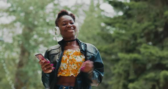 Woman with Headphones Dancing