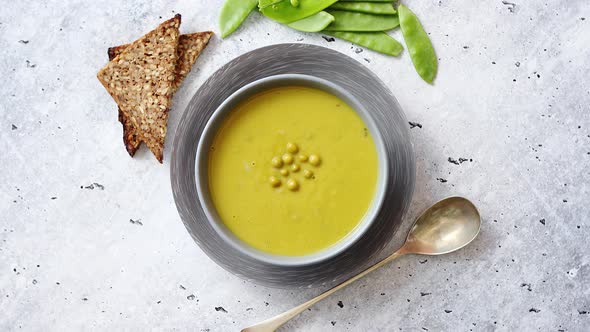 Green Pea Cream Soup in Grey Bowl