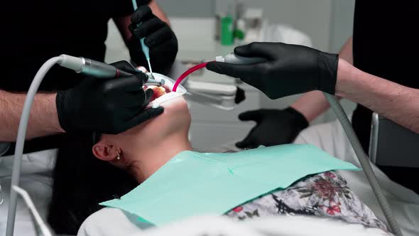 Patient on dental chair. Close up view of female patient during dental operation