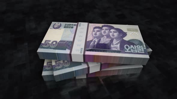 North Korea Won money banknote pile packs