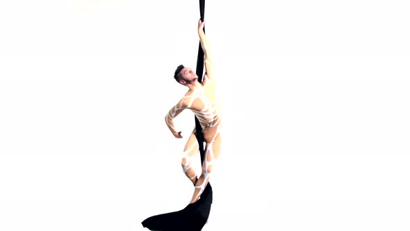 Man Dancer on Aerial Silk, Aerial Contortion, Aerial Ribbons, Aerial Fabric in Posing Exercise
