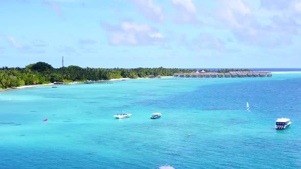 Aerial drone tourism of shore beach by blue ocean and sand background