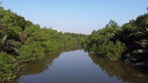 Fly low angle at the small river Sungai Jawi