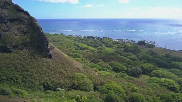 Aerial view of Ko'olau mountainside at Kualoa Kaneohe on a sunny day