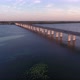Aerial Shot of a Far-off Bridge Over the Dnipro From a Drone Flying Along in Summer - VideoHive Item for Sale
