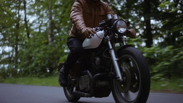 Motorcycle Running Smoothly on a Narrow Road