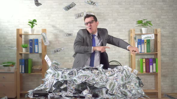 Happy Man Successful Businessman Rejoices in a Pile of Banknotes