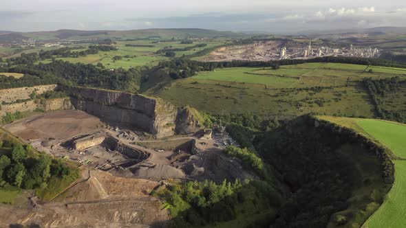 Late afternoon backwards flight revealing a limestone quarry in Derbyshire flying from another one.