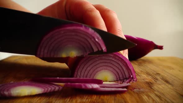 The Cook Cuts Onions