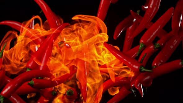 Super Slow Motion Shot of Red Chilli Peppers and Fire at 1000Fps.