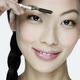 Young woman using eyebrow comb - VideoHive Item for Sale