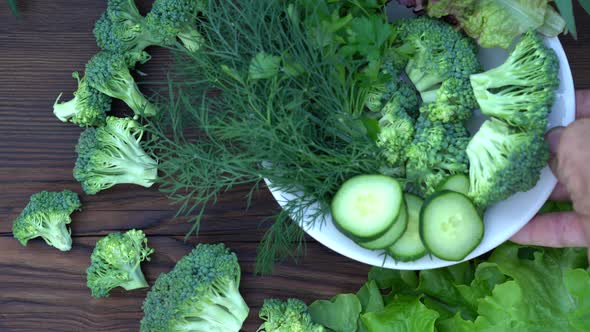 Arrange Fresh Raw Vegetables on a Platter. Platter of Fresh Vegetables on Board. Top View