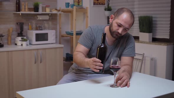 Depressed Man Drinking Alone