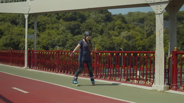 Smiling Female Roller Rollerskating Outdoors