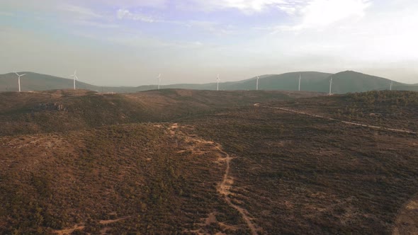 Drone Flies Over a Windmill Park