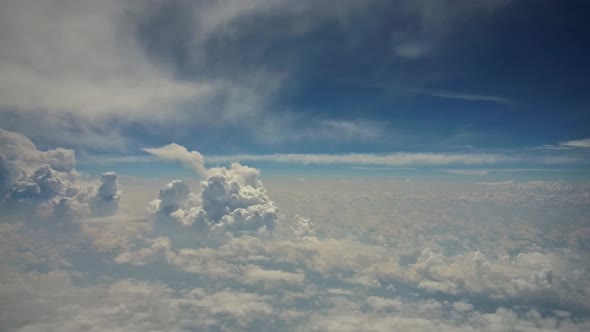 Cloud Top Aerial View on Blue Sky Beautiful Natural Landscape From Airplane Window
