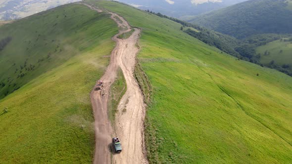 Aerial View Suv Vehicle Going Up By Hill to the Top of Mountain