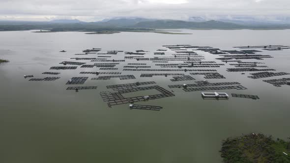 Aerial view of traditional floating fish pond on lake in Indonesia