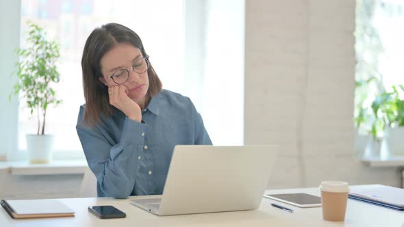 Young Woman Sleeping in Office