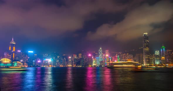 Night Imelapse of Illuminated Hong Kong Skyline. Hong Kong, China