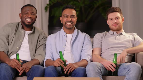 Happy Smiling Male Friends with Beer at Home