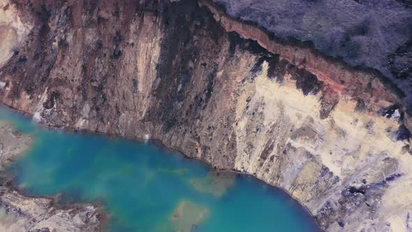A Wonderful Azure Lake with Blue Water in the Clay Quarry of a Natural Canyon