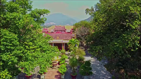 Aerial View of Garden with Buddha Statue House By Mountain