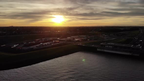 Golden Sunset Over Noord River And A15 Motorway Next To Waste Collection Stations In Hendrik-Ido-Amb