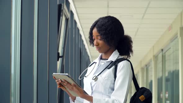 African American Woman Student Intern with a Tablet in the Hospital