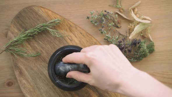 Hands Rubbed The Herbs in a Mortar