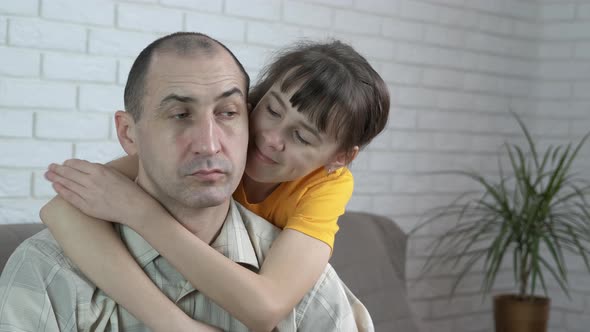 The Girl Hugs Her Father