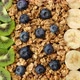 Healthy food granola with kiwi, banana and blueberry. Sliding shot. Healthy Vegan superfood breakfas - VideoHive Item for Sale