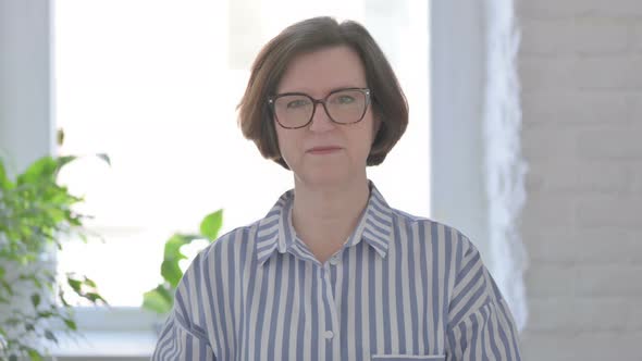 Portrait of Serious Senior Woman Looking at the Camera