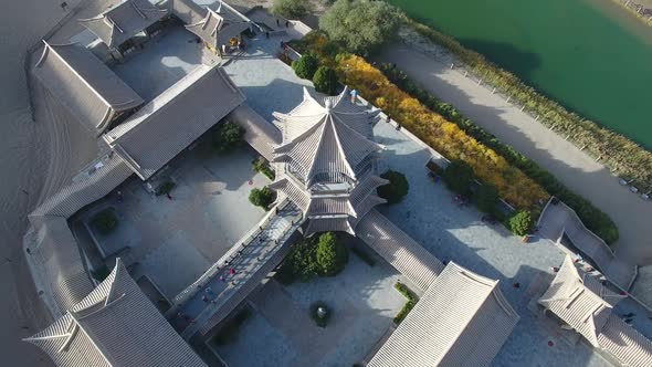 A Small Oasis Among the Lifeless Sands of the Gobi Desert is the Crescent Lake Pagoda in China