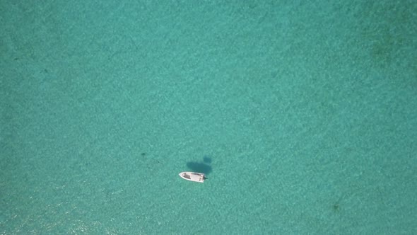 Aerial drone view of a fishing motor boat in the Bahamas, Caribbean. 