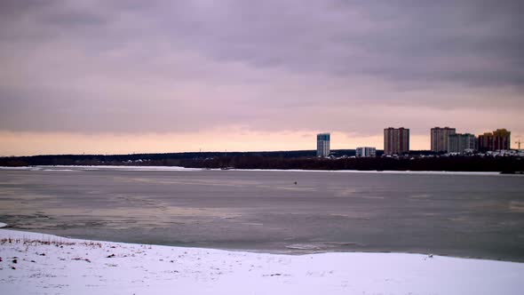 Birds Fly Against the Backdrop of the Setting Winter Sky