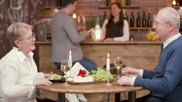 Old Couple on a Date Drinking Wine and Enjoying a Romantic Date