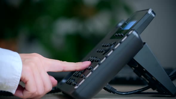 Close-up of women's hands with a phone, workplace