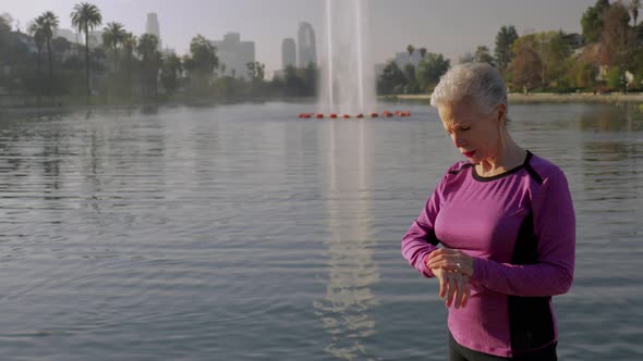 Senior Woman Working Out In The Park